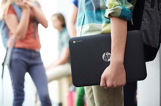 Student carrying computer